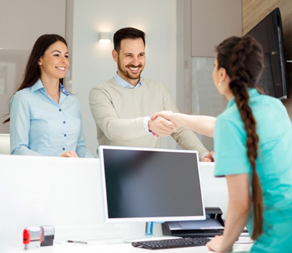 Happy, smiling dental office team