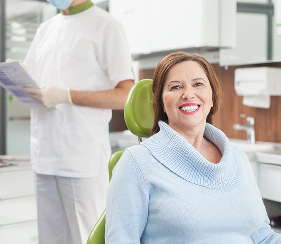 Smiling woman in dentist’s chair